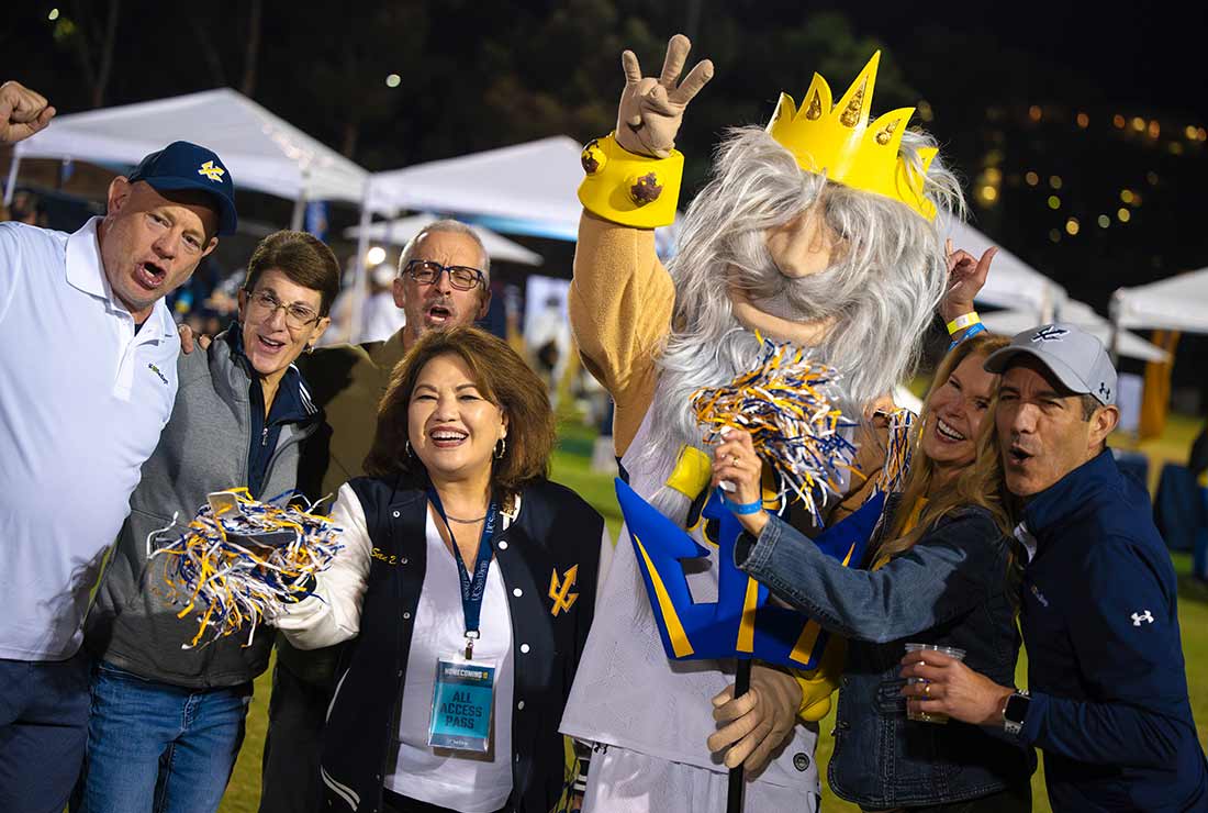 Group of alumni with King Triton mascot